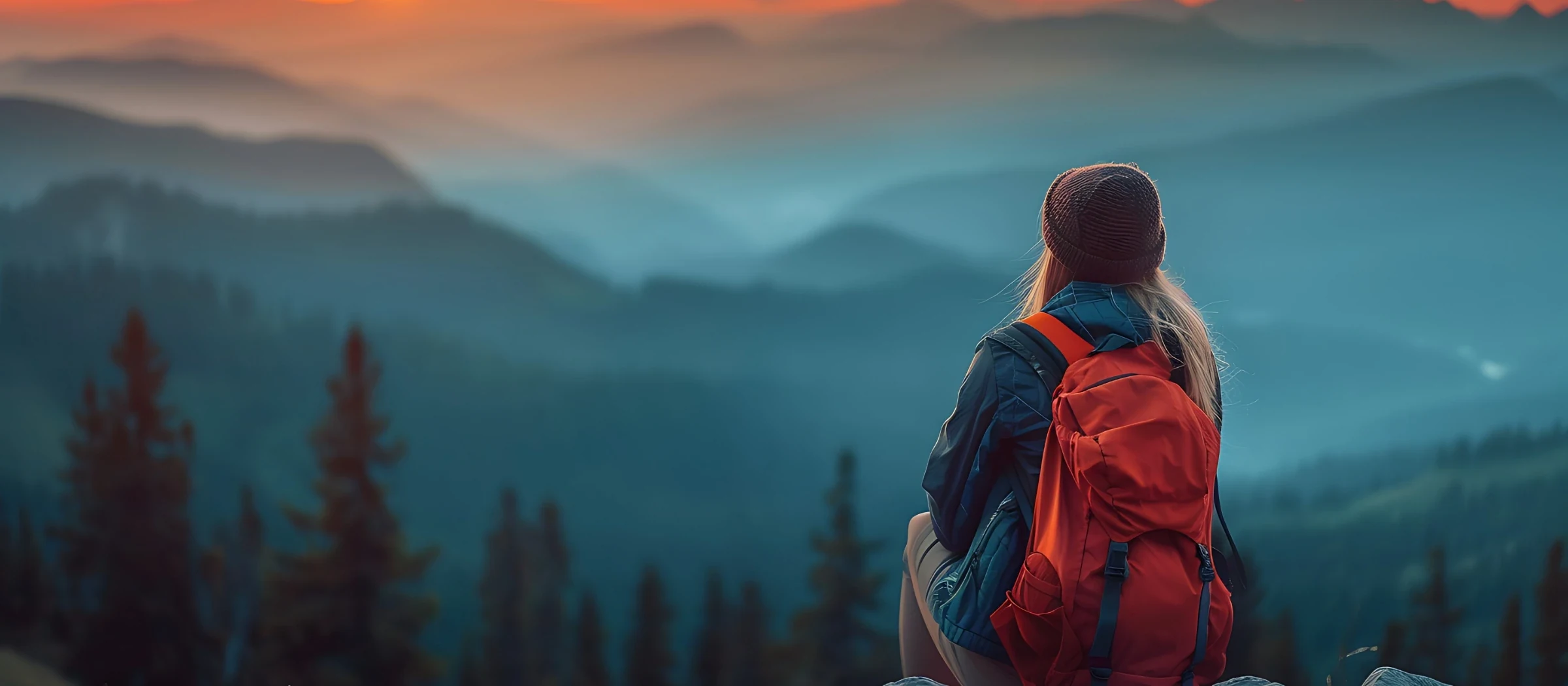 female backpacker taking in mountain view