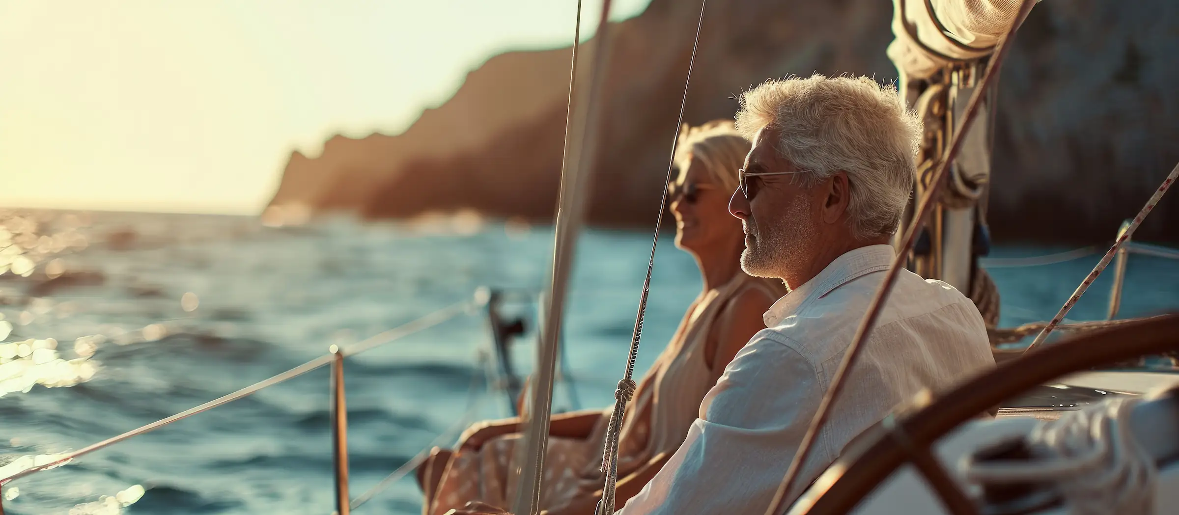 mature couple enjoying boat on the lake