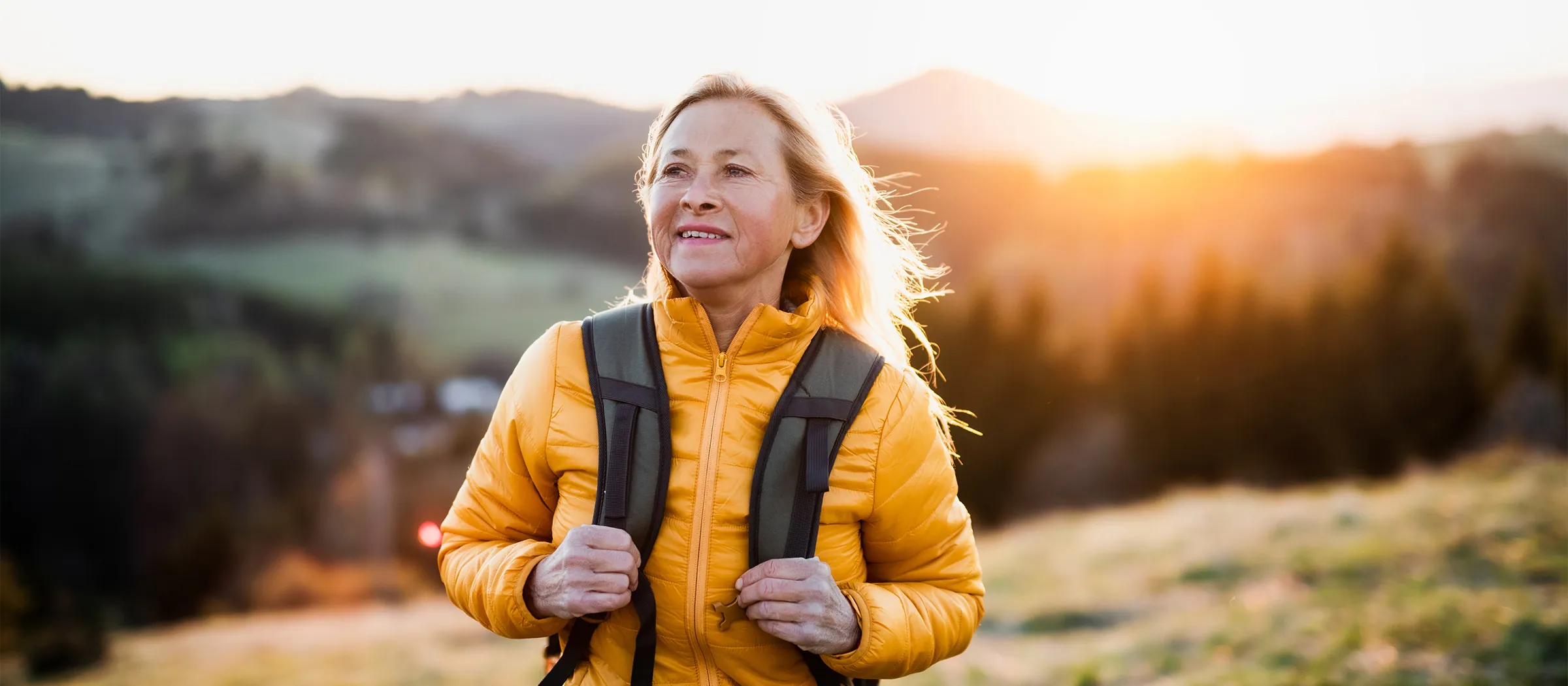 joyful mature woman backpacking with restored vision