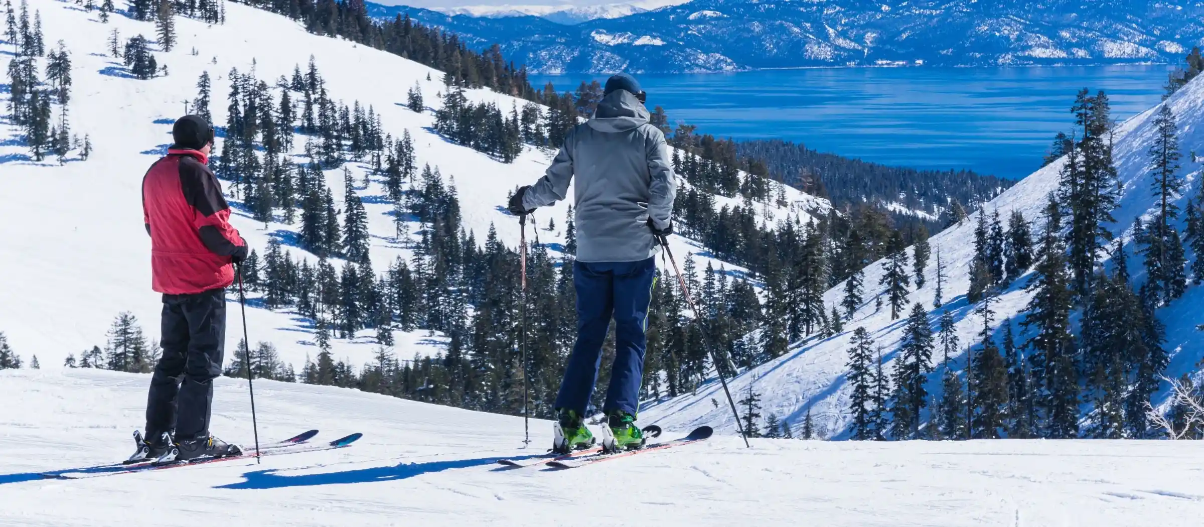 skiers at the top of mountain slope at lake tahoe