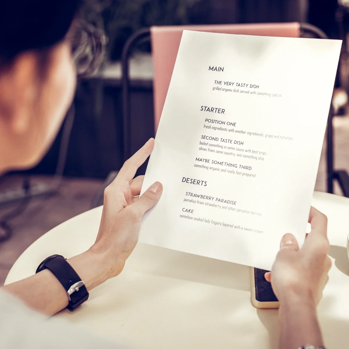 woman reading a menu without the need for glasses