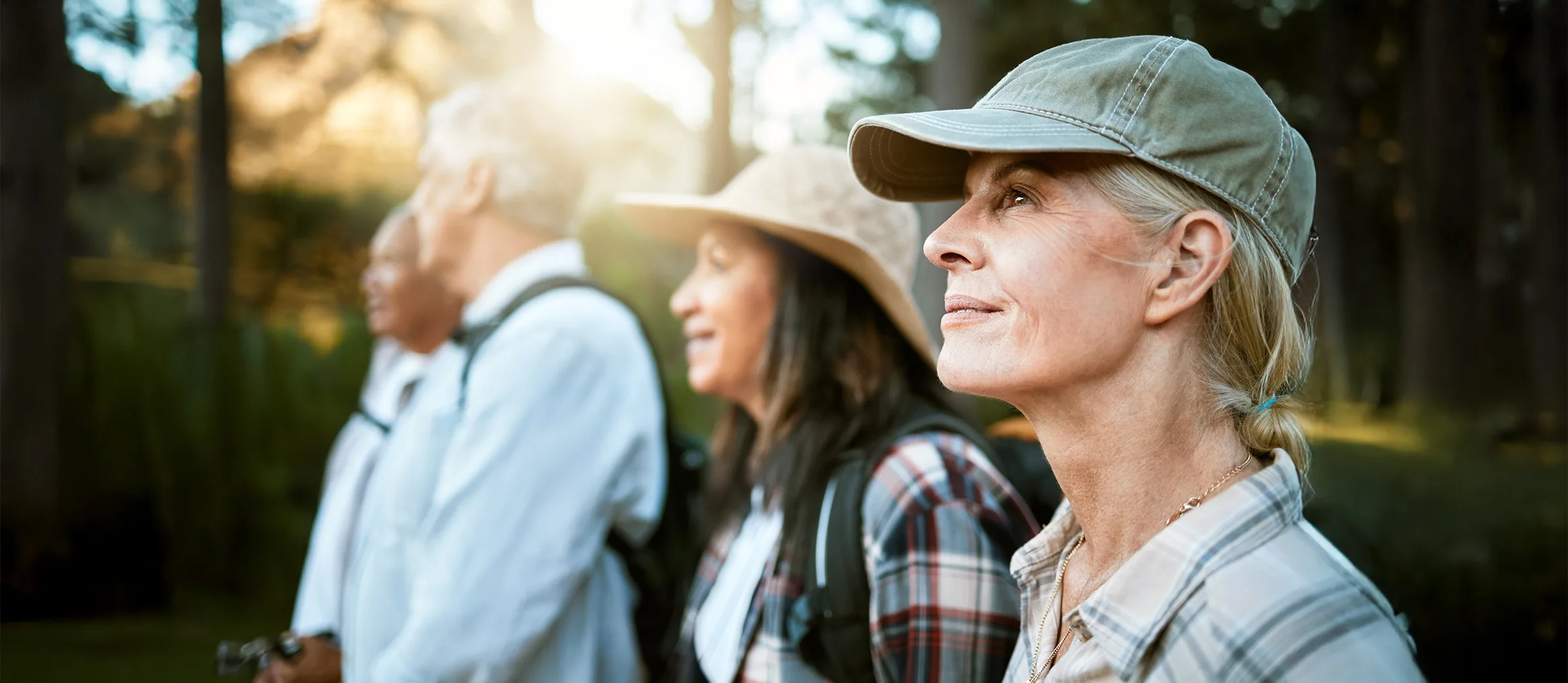 close up of senior woman hiking with friends