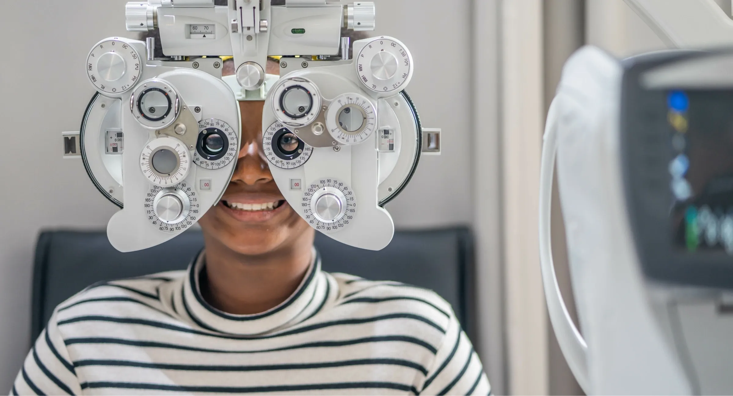 young teen taking vision exam